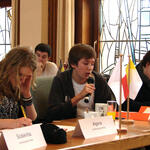 Young people assume the role of delegates of the United Nations.  