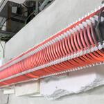 Aufbau der elektrischen Beheizung: Flammrohr mit helixförmiger Aufwicklung des Heizdrahts mit keramischen Abstandshaltern zur gleichmäßigen Wärmeabgabe © VDEh-Betriebsforschungsinstitut GmbH / Kanthal GmbH / WS Wärmeprozesstechnik GmbH / thyssenkrupp Steel Europe AG